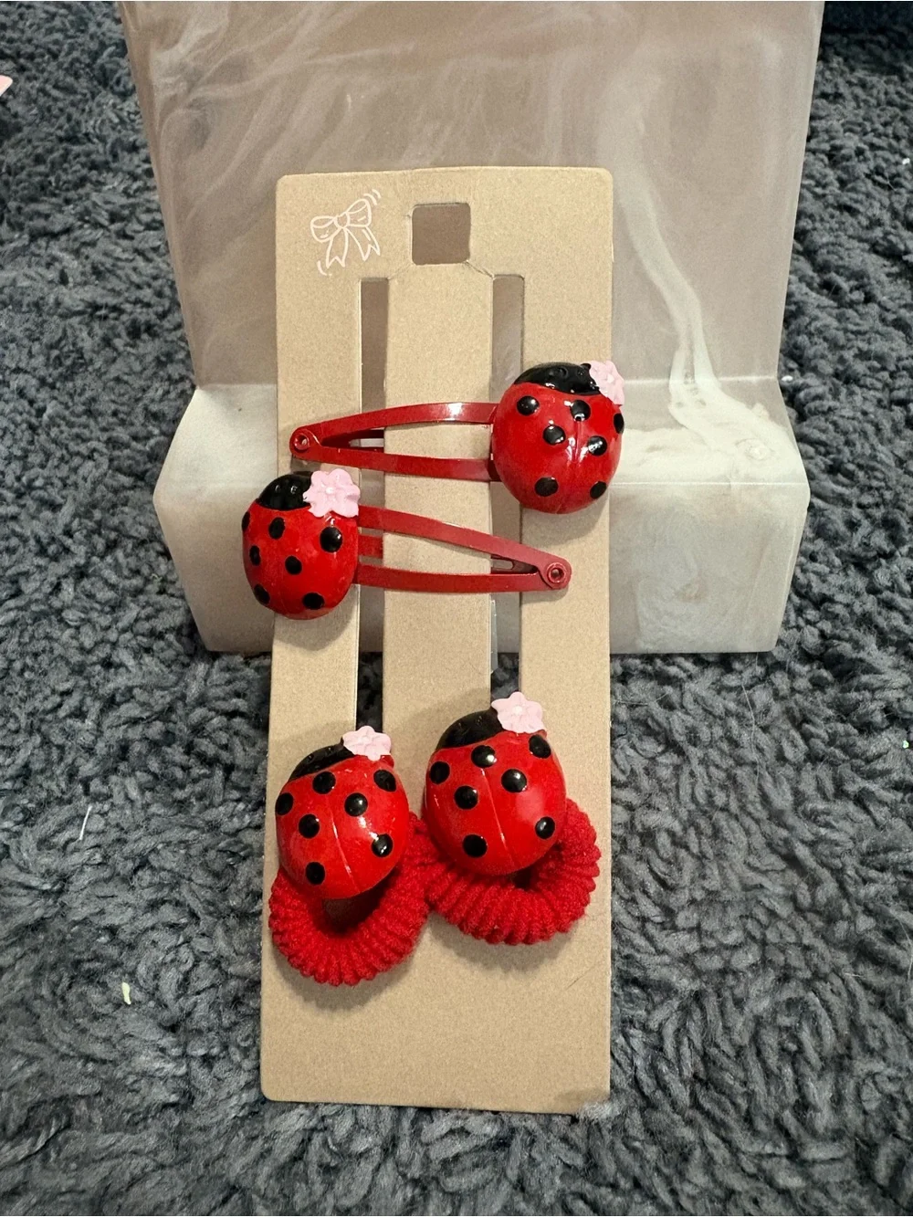 NWT set of 2 ladybug barrettes and 2 hair ties with ladybugs on them